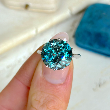 Vintage, Blue Zircon and Diamond Cocktail Ring, 18ct White Gold held in fingers.