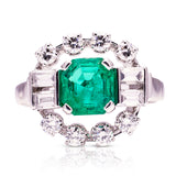 Vintage emerald and diamond cluster ring, front view. 