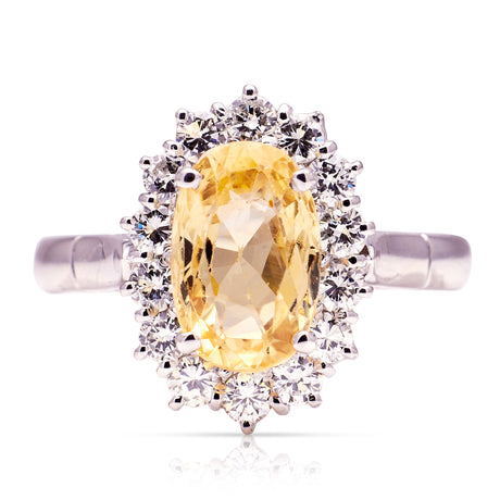 Yellow sapphire and diamond cluster engagement ring, front view. 