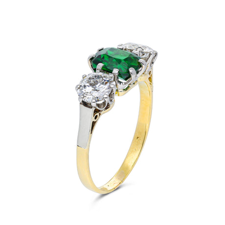 green garnet and diamond three stone ring, side view.