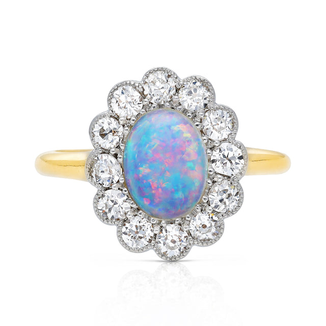 Opal and diamond cluster ring, front view.