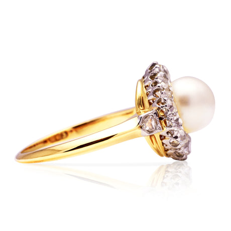 Antique pearl and diamond cluster ring, side view. 