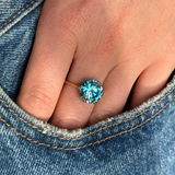vintage art deco zircon single stone ring worn on hand in pocket of jeans.