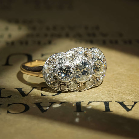Antique 1900s diamond cluster panel ring with old cut diamonds in elongated setting