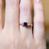 Close detail of antique 1920s sapphire and diamond three-stone ring.