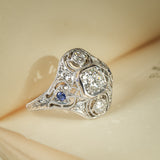 Antique Art Deco diamond ring with sapphire cluster accents