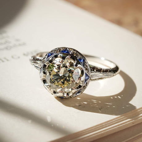 Antique Art Deco diamond and sapphire cluster ring in white gold