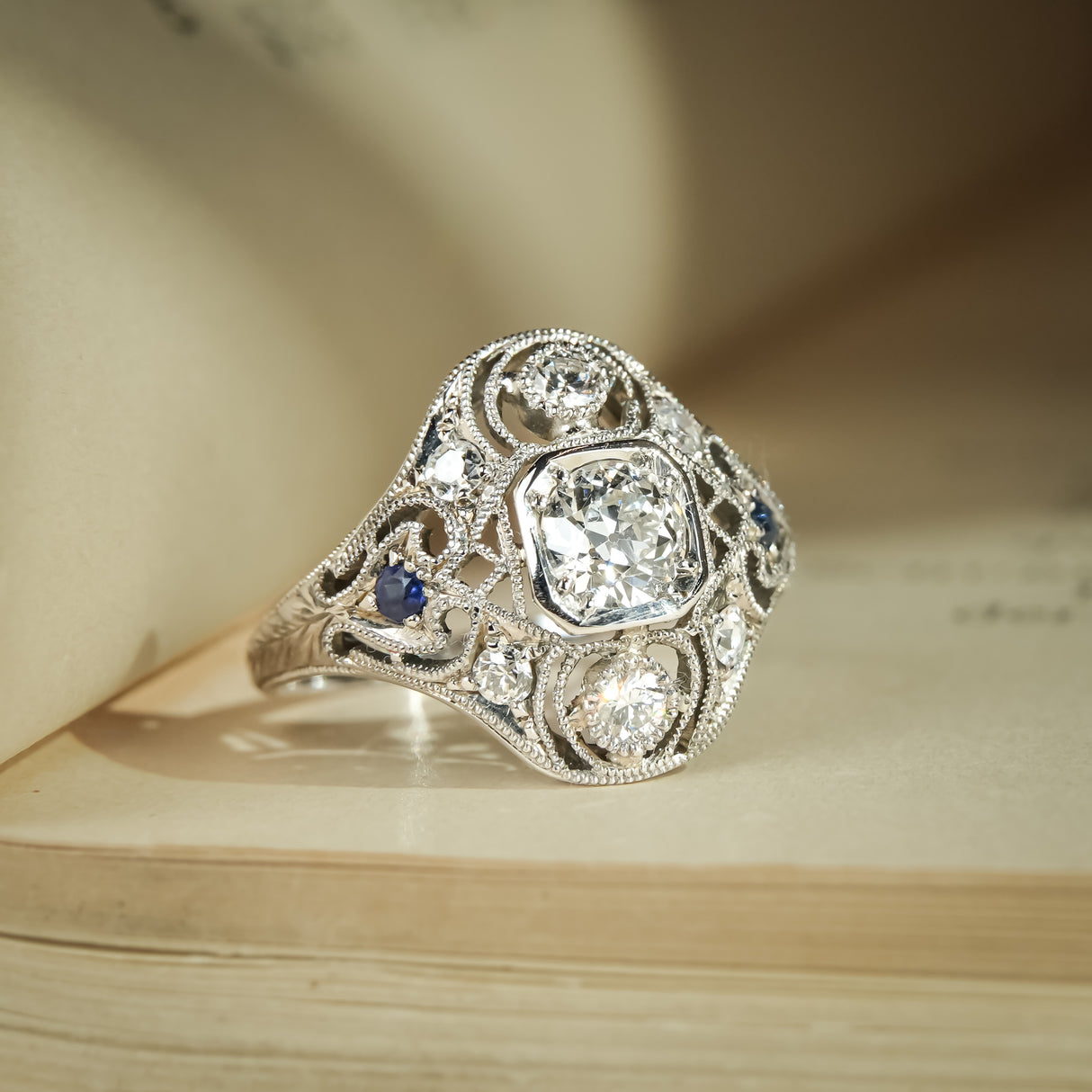 Antique Art Deco diamond and sapphire cluster ring in platinum