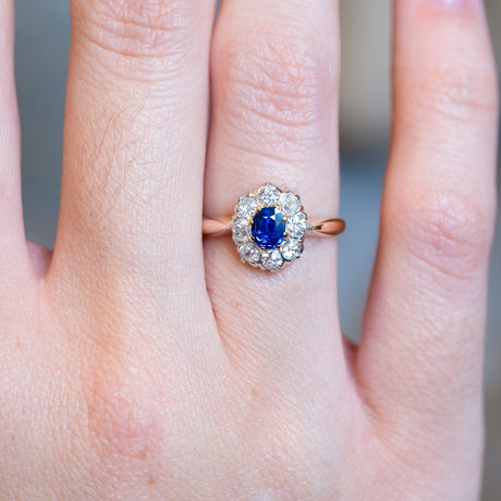Antique Belle Époque sapphire and diamond cluster ring with vivid blue sapphire centre stone.