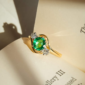 Antique Edwardian ring with emerald center and diamond side stones