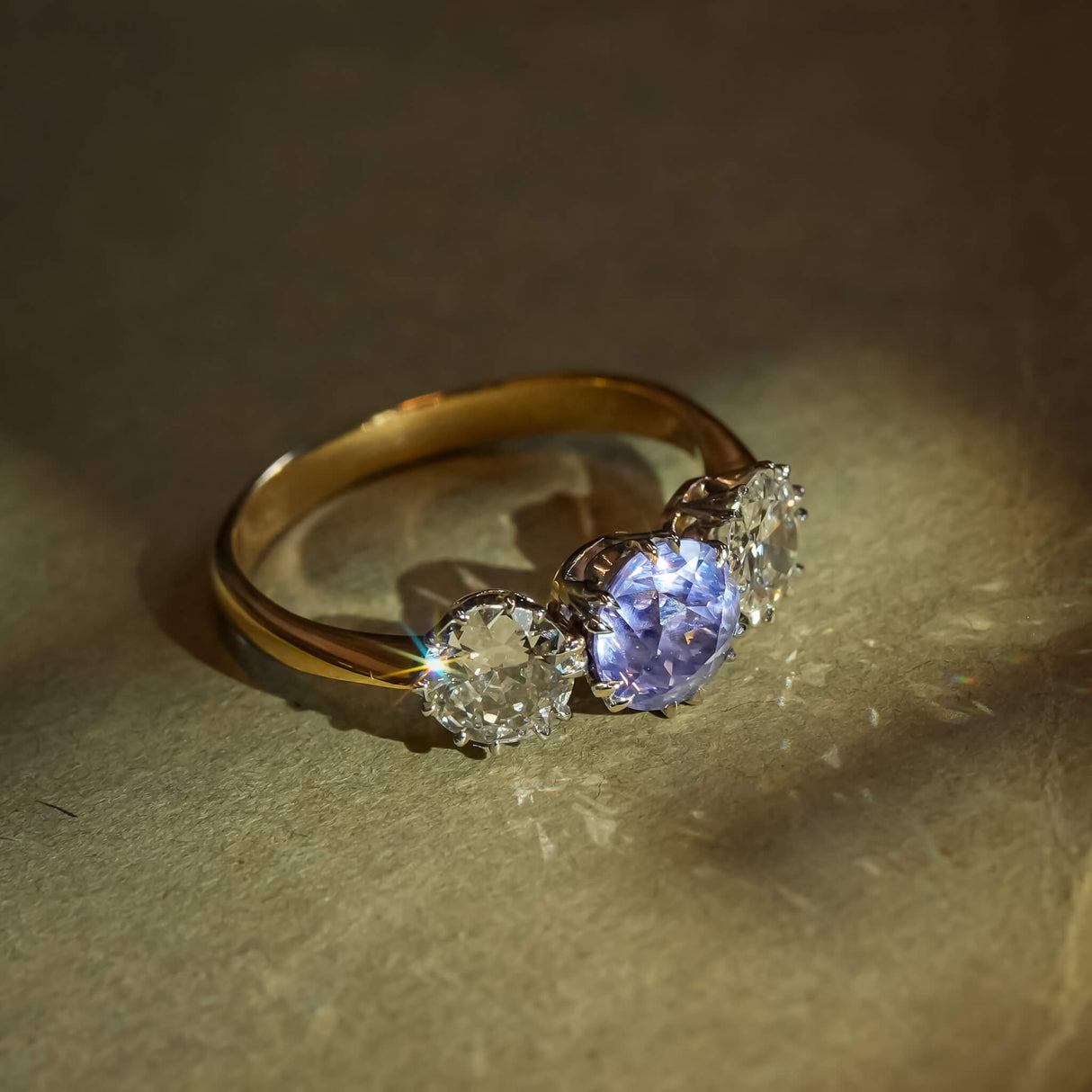 Antique Edwardian gold ring with sapphire center and diamond accents