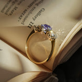 Antique Edwardian sapphire and diamond three stone engagement ring in yellow gold