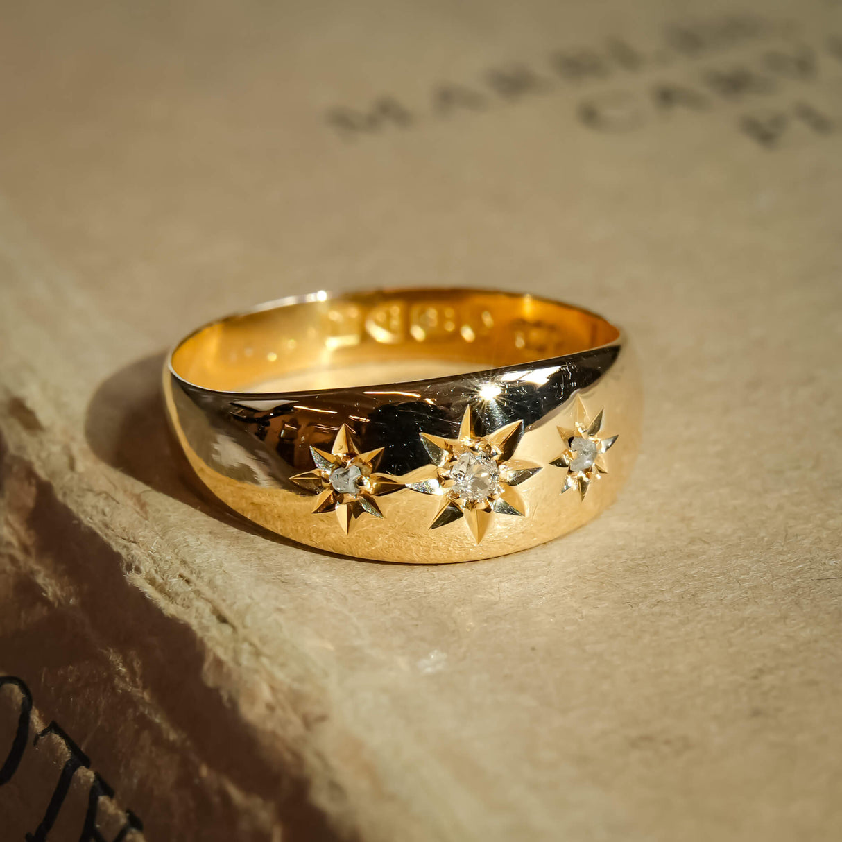 Antique Edwardian three stone diamond gypsy ring in yellow gold