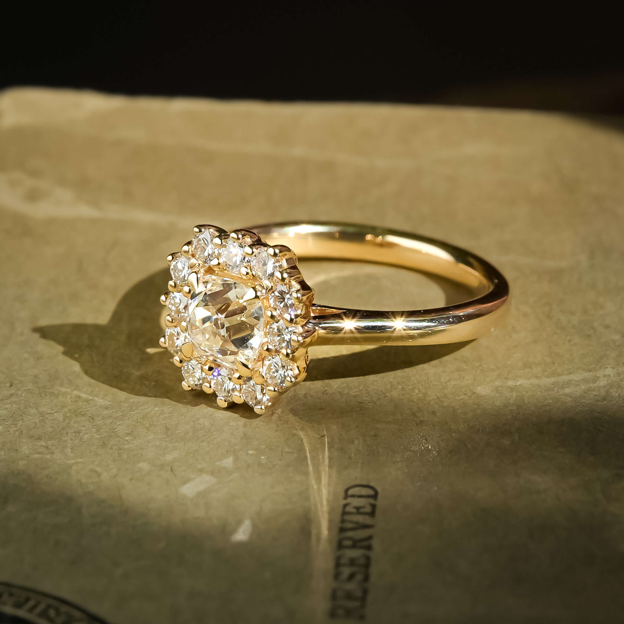 antique inspired cushion diamond cluster ring with sparkling halo diamonds