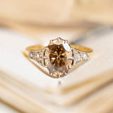 Antique-inspired hazelnut-brown diamond engagement ring with rose-cut diamond accents in yellow gold.