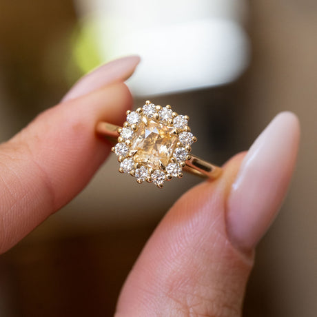 Antique inspired primrose-yellow sapphire and diamond cluster engagement ring showing the open gallery beneath the sapphire and diamond cluster.