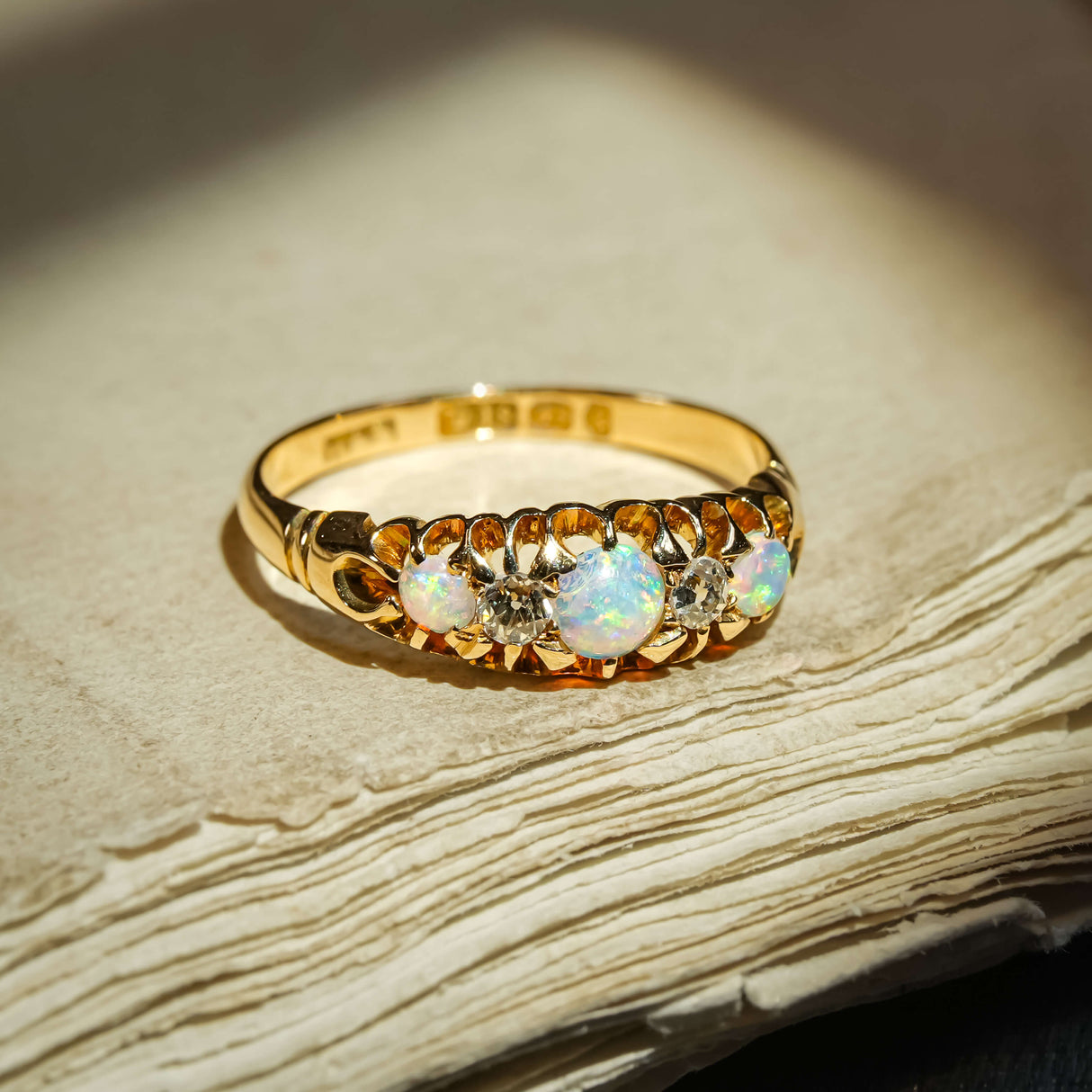 Antique late Victorian opal and diamond five stone ring with graduating opals and diamond accents