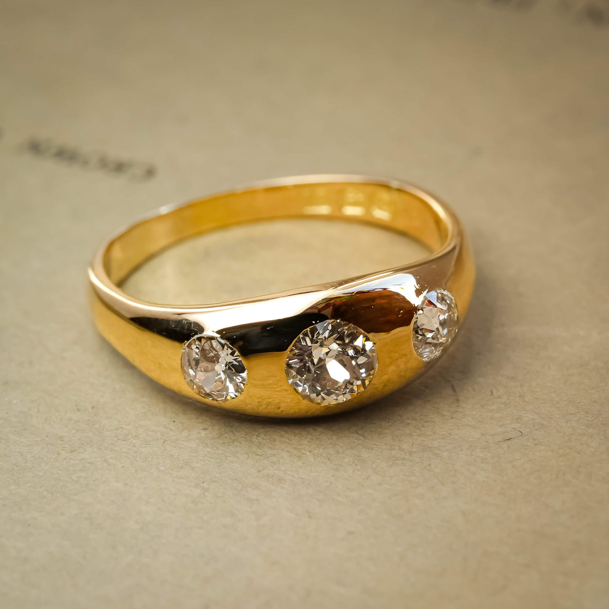 antique old cut diamond three stone gypsy ring with edwardian style in yellow gold