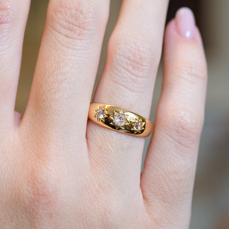 Close up of antique Edwardian gypsy ring with old-mine cut diamonds.
