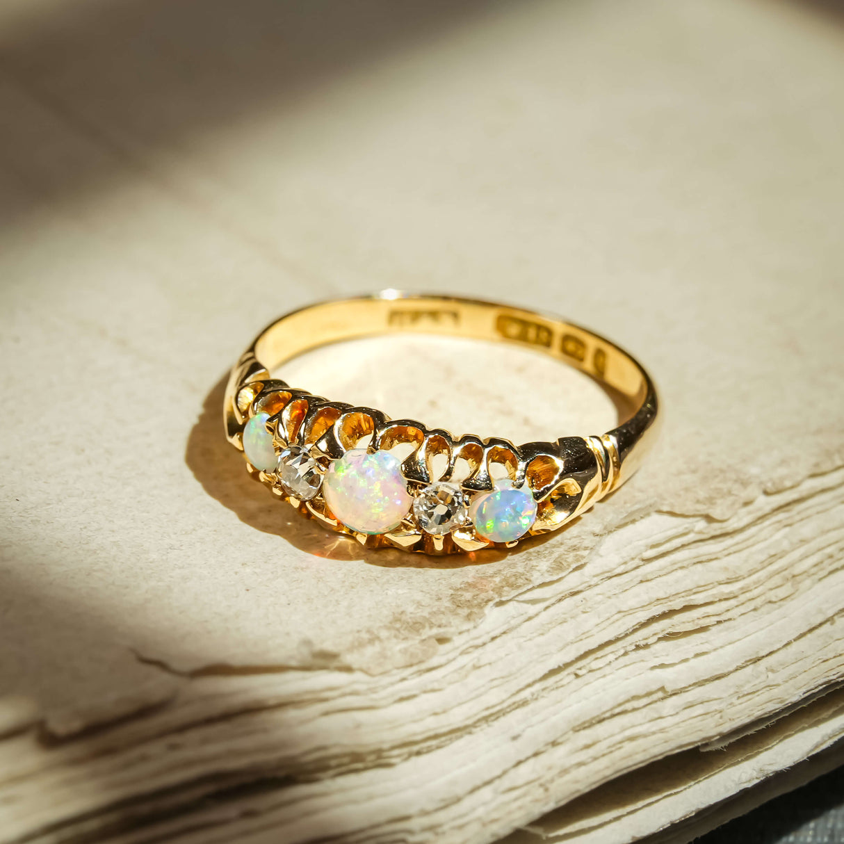 Antique late Victorian opal and diamond ring with five stone setting and opal gemstones