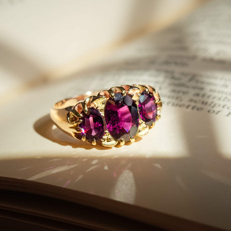Antique rhodolite garnet three stone ring with Victorian design