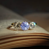 Antique sapphire engagement ring with two diamonds in three stone setting