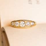 Antique Victorian old-mine cut diamond five-stone ring in yellow gold with graduated old-cut diamonds.