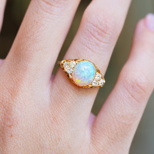 Antique Victorian opal and diamond ring showing iridescent opal and diamond setting detail.