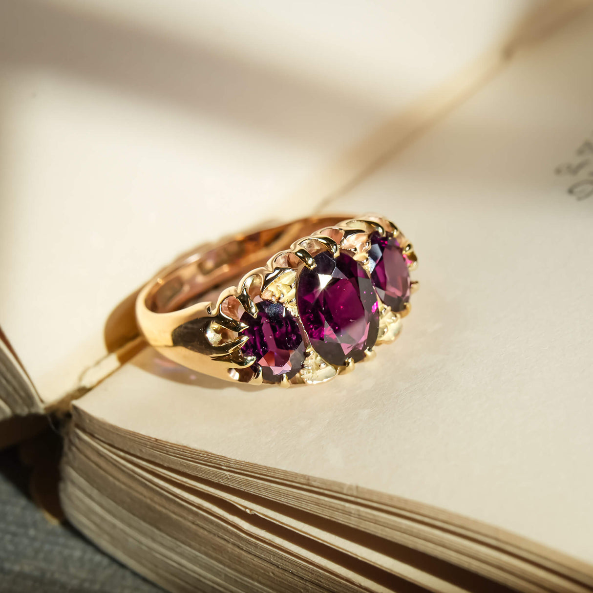 Antique Victorian rhodolite garnet three stone ring in yellow gold