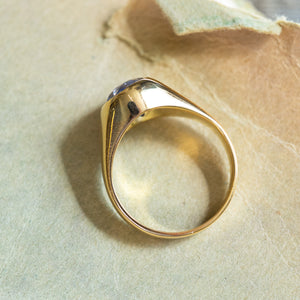 Antique Victorian sapphire single-stone ring showing polished gold band and antique setting profile.