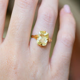 Close detail of an antique Victorian elongated yellow sapphire solitaire ring.