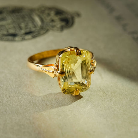 Antique cushion cut yellow sapphire solitaire ring in yellow gold