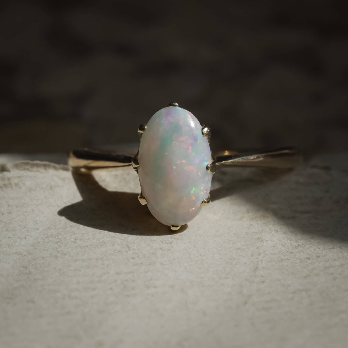 Vintage 1990s precious opal solitaire ring in yellow gold