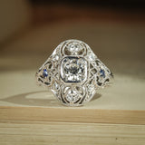 Art Deco antique diamond and sapphire cluster ring with milgrain detail