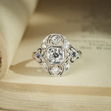 Art Deco diamond cluster ring with sapphire accents in antique design