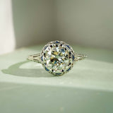 art deco diamond cluster ring with sapphire accents in white gold