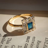 art deco sapphire diamond cluster ring with square halo in yellow gold