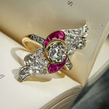 Art Nouveau ruby and diamond cocktail ring with central diamond and pink ruby details