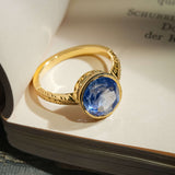 Ceylon sapphire solitaire ring with cornflower blue gemstone in gold setting