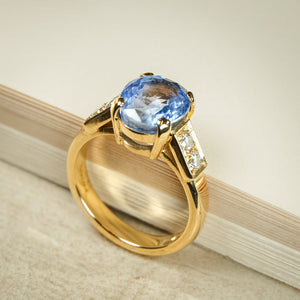 Blue sapphire and diamond engagement ring in vintage 1990s style