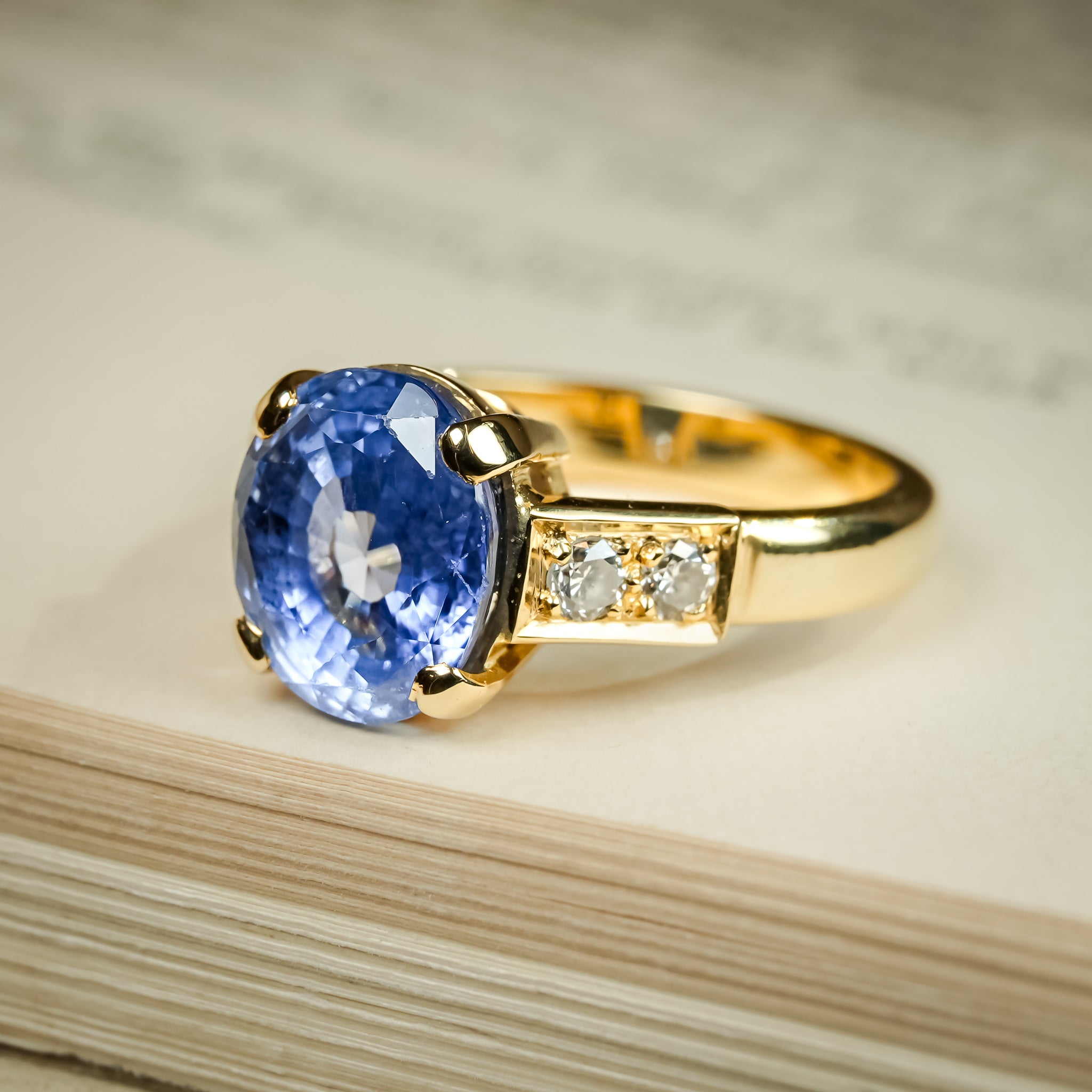 Blue sapphire and diamond three stone engagement ring from 1990s
