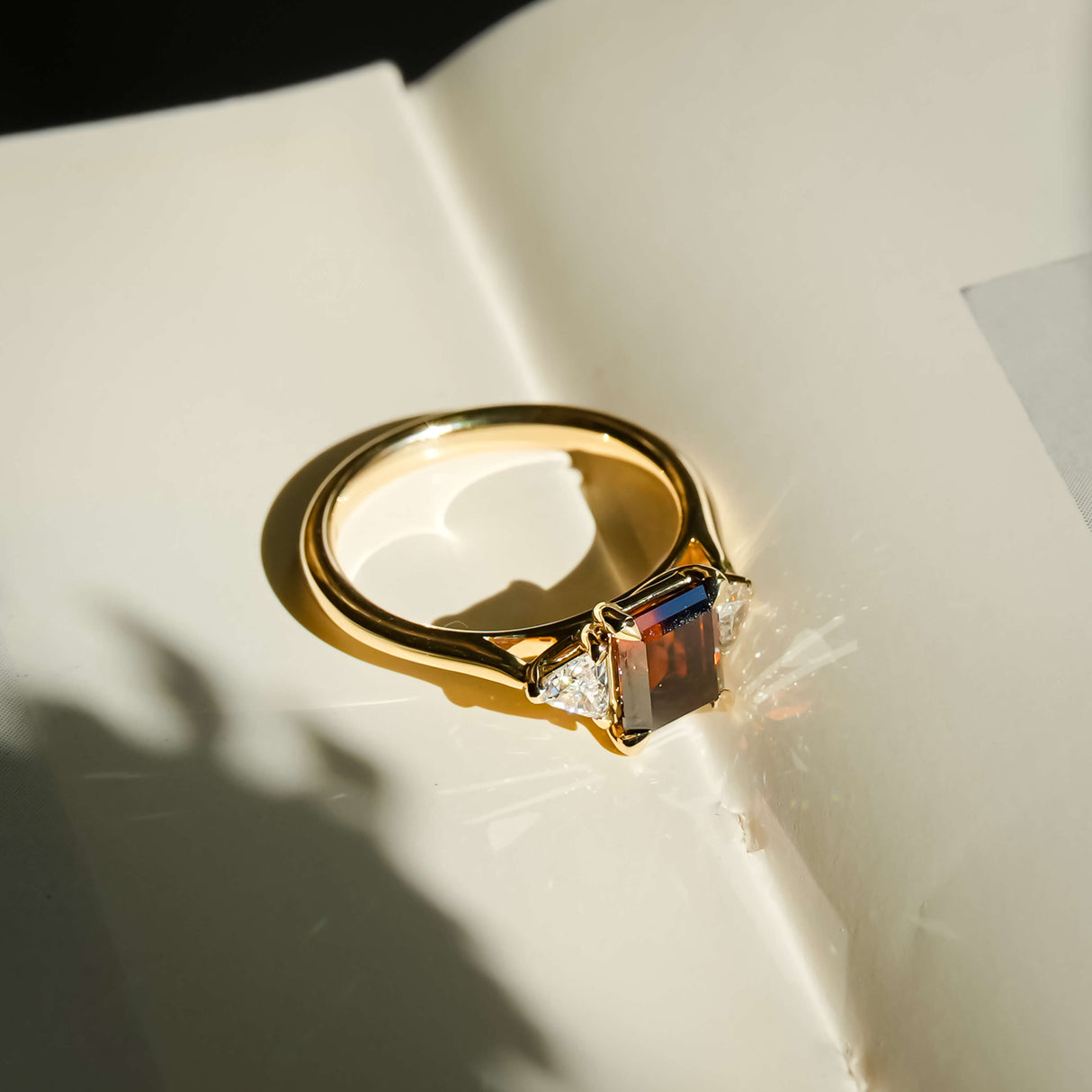 brown diamond three stone ring with white diamond side stones