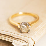 Vintage brown old-mine cut diamond engagement ring featuring an antique-cut diamond and yellow gold band.