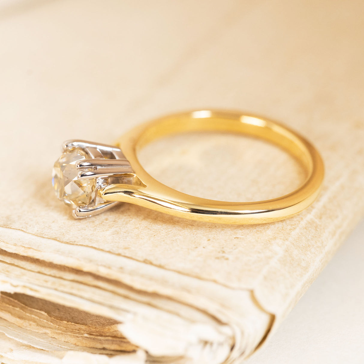 Vintage 1950s solitaire ring with a brown old-mine cut diamond mounted in a classic yellow gold setting.