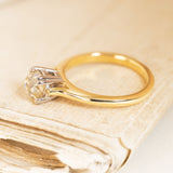 Vintage 1950s solitaire ring with a brown old-mine cut diamond mounted in a classic yellow gold setting.