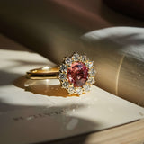 burnt orange sapphire diamond halo engagement ring with yellow gold band