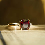 Cushion cut 3ct ruby and side diamonds three stone engagement ring in yellow gold