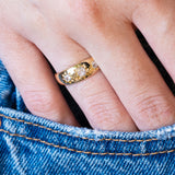Antique Edwardian old-mine cut diamond gypsy ring styled with denim pocket.
