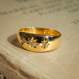 Edwardian three stone diamond gypsy ring with star set diamonds