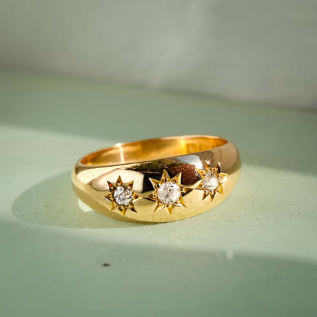 Edwardian diamond three stone gypsy ring with antique design in yellow gold